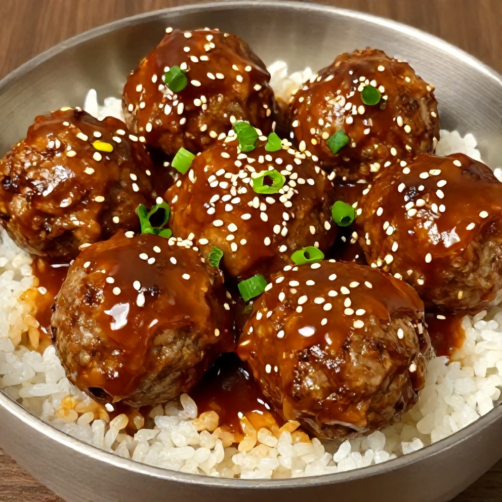 Korean BBQ Meatball Rice Bowl with green onions and sesame seeds