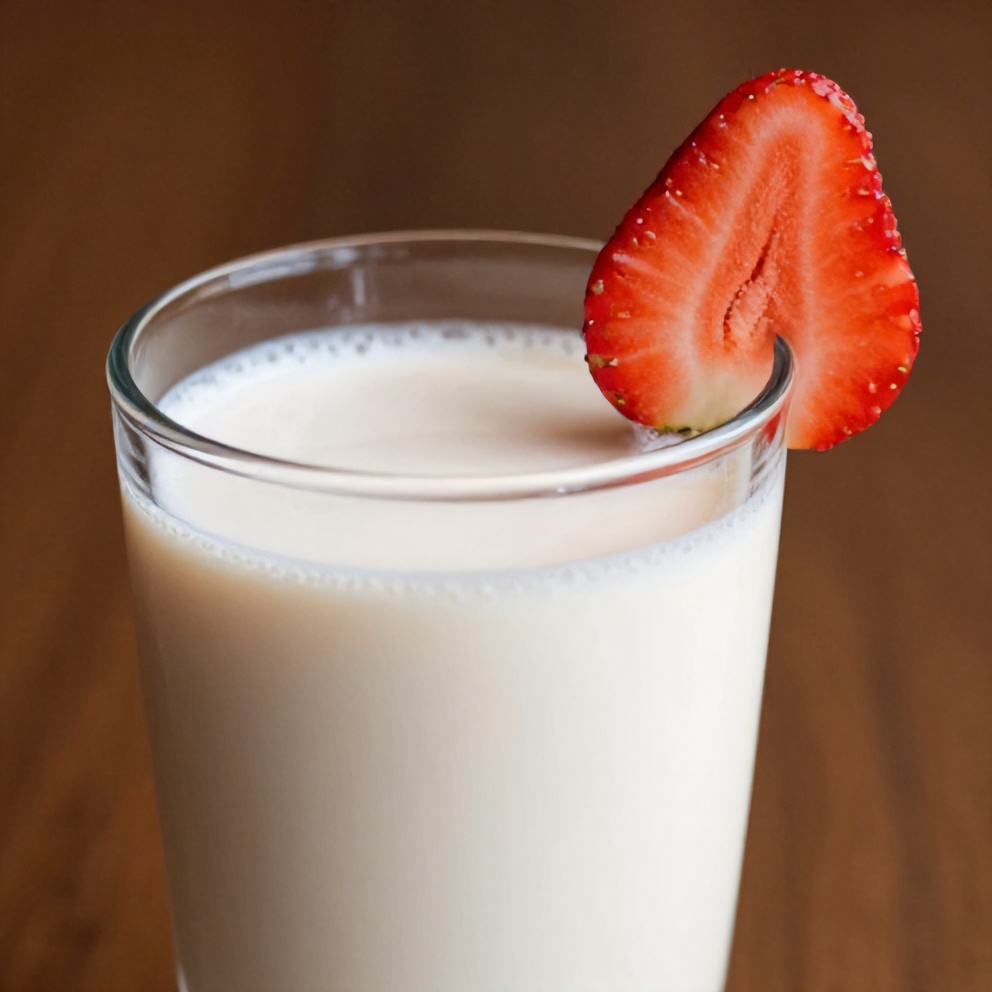 Glass of Korean strawberry milk with a strawberry slice