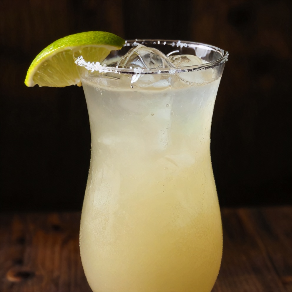Coconut water margarita garnished with a lime wheel
